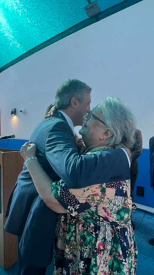 Governor Carney embraces Maria Matos of Latin American Community Center